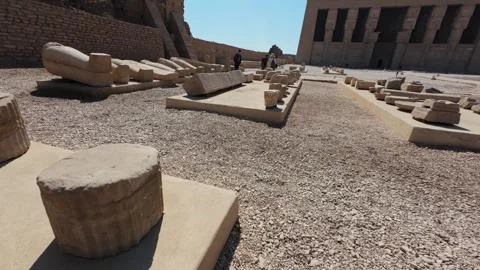 Exposed broken pillars and ruins in courtyard of Dendera Temple complex in Egypt Stock Footage 309755071