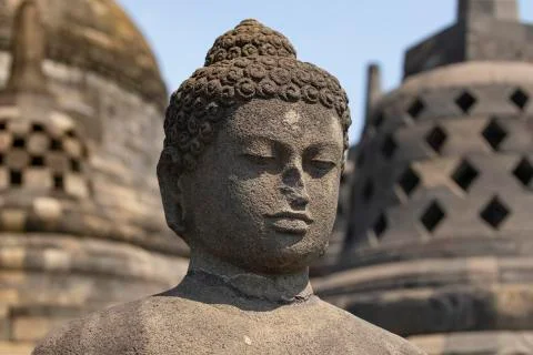 Exposed Buddha, reaching Nirvana, on top of the Borobudur temple, Indonesia Stock Photos