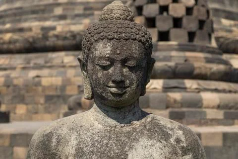 Exposed Buddha, reaching Nirvana, on top of the Borobudur temple, Indonesia Stock Photos