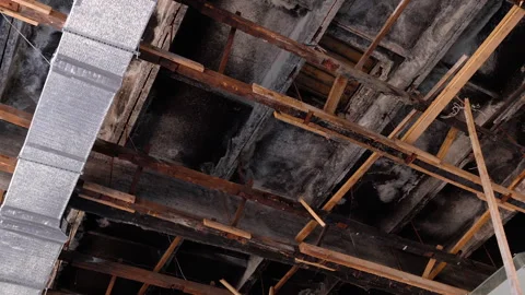 Exposed ceiling structure reveals intricate wooden beams and metal ductwork Stock Footage 318713812