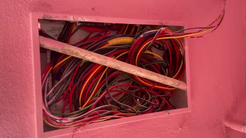 Exposed Electrical Wiring Inside Wall Junction Box with Colorful Cables Video stock 327510025