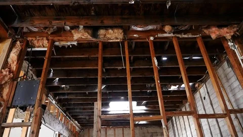 Exposed framing in a neglected, rundown building Stock Footage 72562003