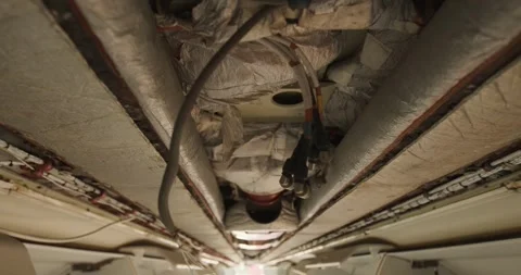 Exposed Insulation and Cabin Wiring in Dismantled Airplane, Low Angle Shot Stock Footage 340307616