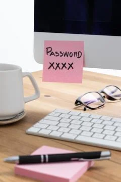 Exposed Login Information on Sticky Note Attached to Computer Screen Stock Photos