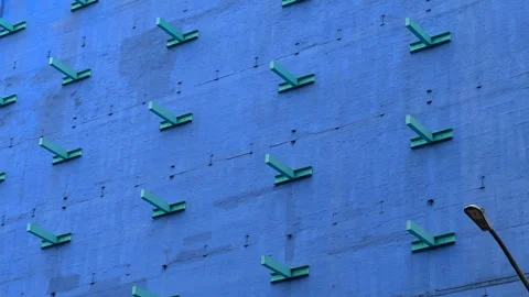 Exposed metal structure beams on side of building, New York City - 4K Prores Stock Footage 244504614