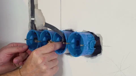 Exposed wire in the electrical wiring in the wall Video stock 167784584