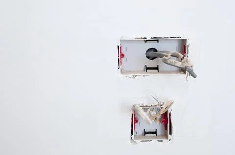 Exposed wiring in an unfinished plug socket Stock Photos