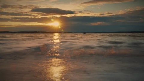 Exposure of water surface with ripples at sunset over the lake. Time lapse video Stock Footage 286122206