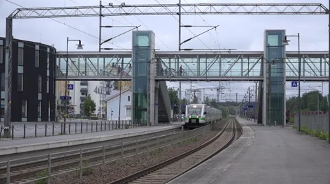 Express passenger train from Oulu to Helsinki departs from the Mikkeli Station Stock Footage 65797434