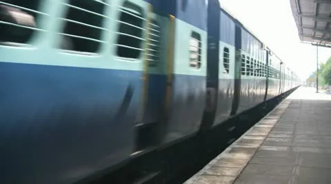 Express passenger train passes through station in India Stock Footage 21250483