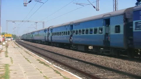 Express passenger train passes through station in India Stock Footage 21252574