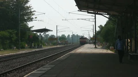 Express passenger train passes through station in India Stock Footage 21252598