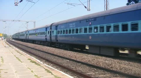 Express passenger train passes through station in India Stock Footage 21253296
