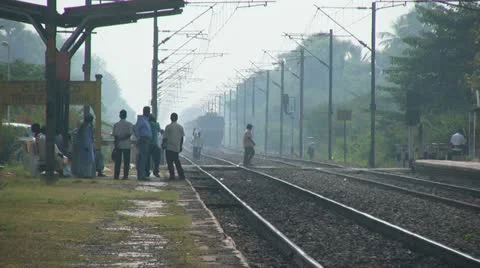 Express passenger train passes through station in India Stock Footage 21258013