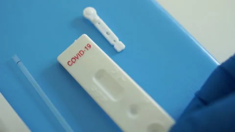 Express test covid-19. Unpacking the Sars-Cov-2 Coronovirus Rapid Diagnostic Kit Video stock 130669083