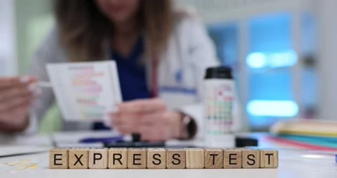 Express Test word tiles with busy doctor suggesting quick check Video stock 314104863