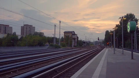 Express train passes train station in Berlin at sunset 動画素材 126902030