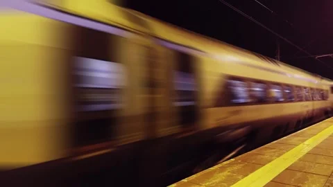Express Train Passing Through Rural Station At Dusk With Motion Blur Видео 295046365