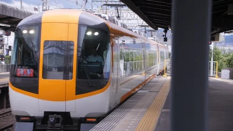 Express Train Pulls Through Mukaijima Station - Kyoto, Japan Stock Footage 95913202