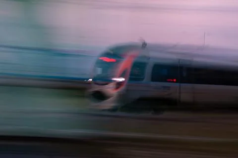 Express train rushing at high speed in blurred background Stock-Fotos