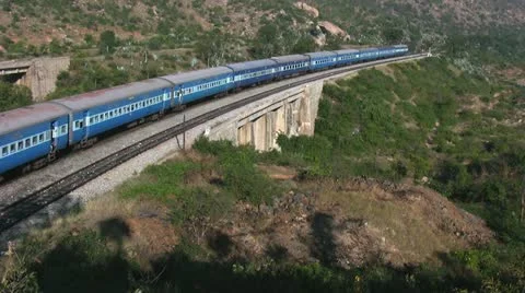 An Express train speeds through Makalidurga station near Bangalore India. Stock Footage 21238863