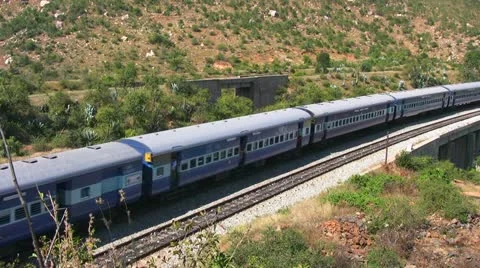 An Express train speeds through Makalidurga station near Bangalore India. Stock Footage 21238999