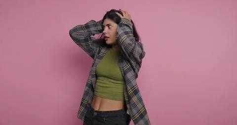 Expressing emotions through vibrant poses in a playful studio setting Vídeo Stock 329109315
