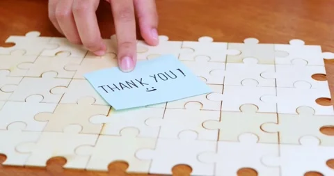 Expressing gratitude a personal touch a jigsaw puzzle a cozy home setting Stock Footage 312928798
