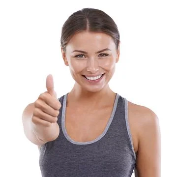 Expressing positivity. Portrait of a positive young woman showing you the thumbs Stock Photos