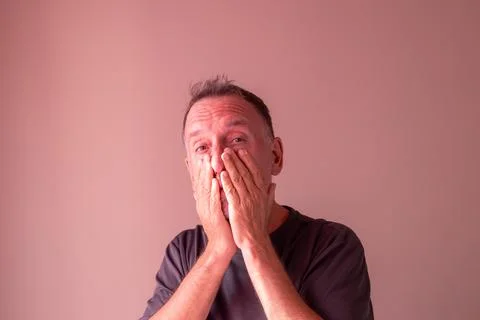 Expression of astonishment in a man between 55 and 60 years old. Stock Photos
