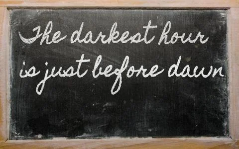 Expression -  the darkest hour is just before dawn - written on a school blac Stock Illustration