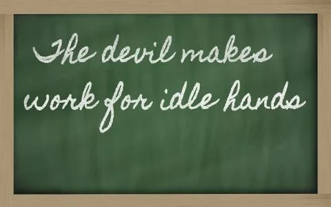 Expression -  the devil makes work for idle hands - written on a school black Illustrazione stock