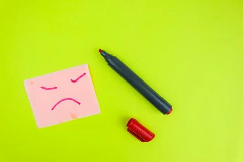 An expression drawn on a sticky note with a red marker on a lime color backgr Stock Photos