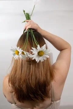 Expression of Femininity Through Health and Beauty With Flowers in Hair Stock Photos