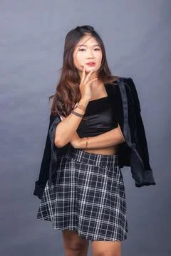 Expression girl smile formal thin hand to neck Stock Photos