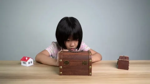 An expression of girl try to open the treasure box Stock Footage 221537790