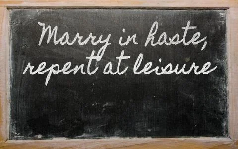 Expression -  marry in haste, repent at leisure - written on a school blackbo Stock Illustration