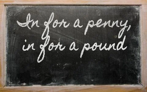 Expression -  in for a penny, in for a pound - written on a school blackboard Stock Illustration