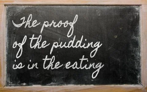 Expression -  the proof of the pudding is in the eating - written on a school Stock Illustration