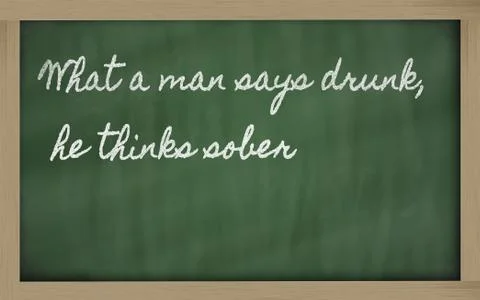 Expression -  what a man says drunk, he thinks sober - written on a school bl Stock Photos