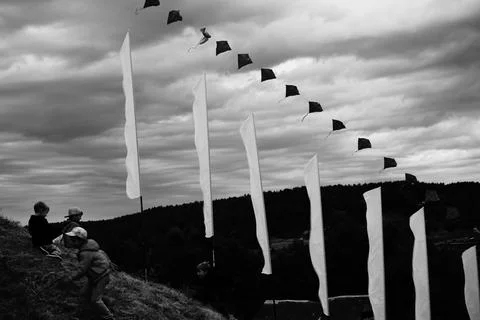 Expression of white flags against the background of a storm Stock Photos