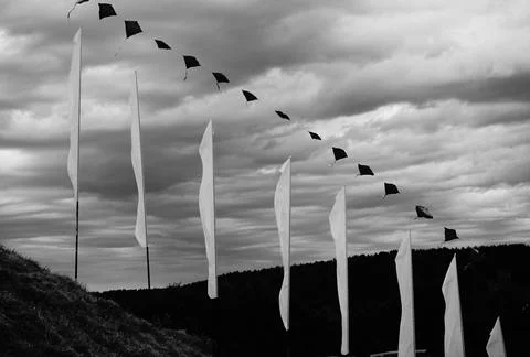 Expression of white flags against the background of a storm Stock Photos
