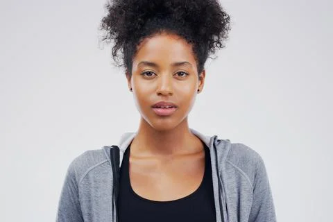 Expressionless. Studio portrait of an attractive young woman posing Stock Photos