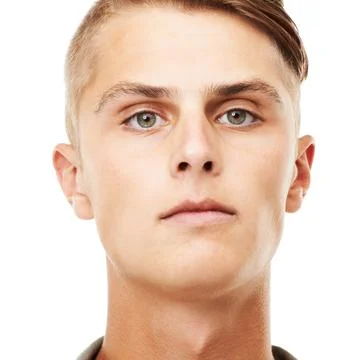 Expressionless style. A closeup portrait of a serious looking young man isolated Stock Photos