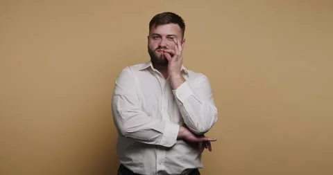 Expressions of thought and surprise in four frames with a man in a white sh.. Stock-Footage 329110053