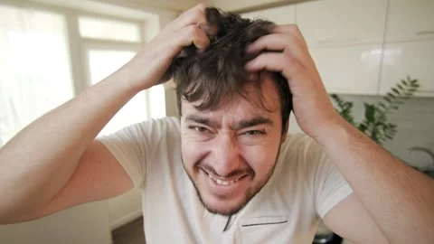 Expressions Unveiled Dermatological Head Scratch, Wide Eyed Tousle A Portrait of Stock Footage 260220033