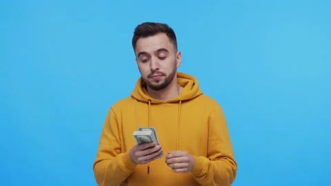 Expressive and happy man with a bunch of money. Person who won jackpot. Lottery Stock Footage 137807701