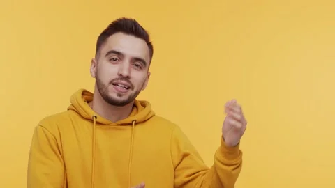 Expressive and happy young man over vibrant background. Studio portrait of Stock Footage 137659503