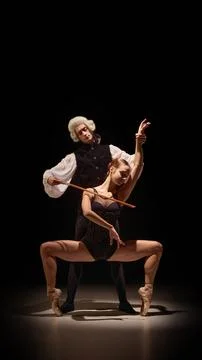 Expressive ballet pose guided by classical mentor in emotional body-as Stock Photos