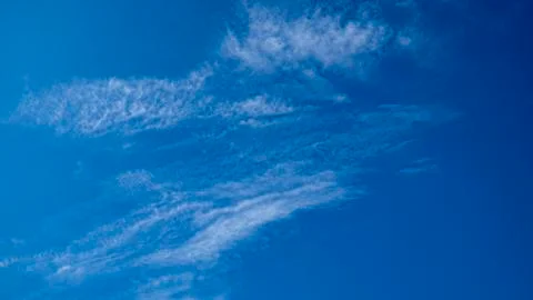 Expressive blue sky with white clouds Stock Photos